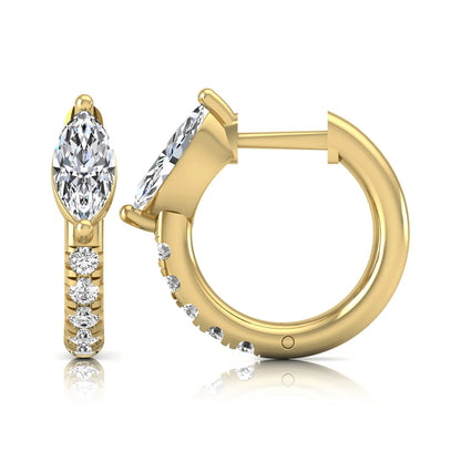 Marquise and round lab grown diamond pavé huggie hoop earrings featuring a vertical two prong marquise center diamond with graduated round pavé diamond accents in yellow gold.