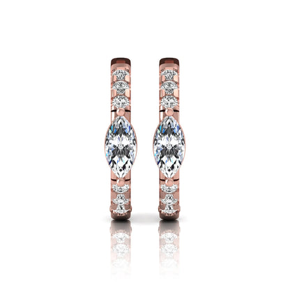 Marquise and round lab grown diamond pavé huggie hoop earrings featuring a vertical four prong marquise center diamond with graduated round pavé diamonds in rose gold.