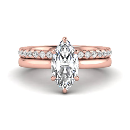 Marquise cut lab grown diamond bridal ring set featuring a six prong solitaire engagement ring with a matching round diamond eternity wedding band in rose gold tone.
