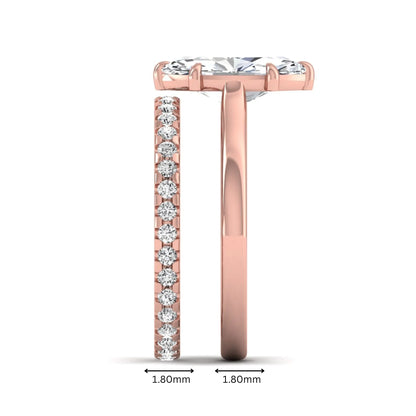Marquise cut lab grown diamond bridal ring set featuring a six prong solitaire engagement ring with a matching round diamond eternity wedding band in rose gold tone.