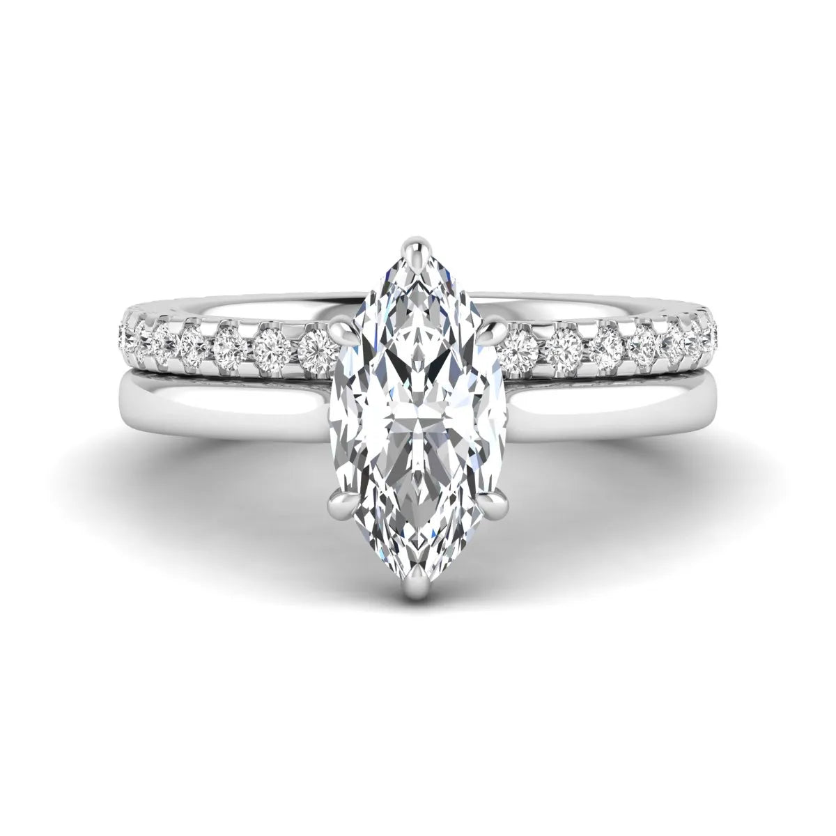 Marquise cut lab grown diamond bridal ring set featuring a six prong solitaire engagement ring with a matching round diamond eternity wedding band in white gold tone.