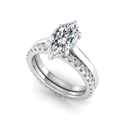 Marquise cut lab grown diamond bridal ring set featuring a six prong solitaire engagement ring with a matching round diamond eternity wedding band in white gold tone.