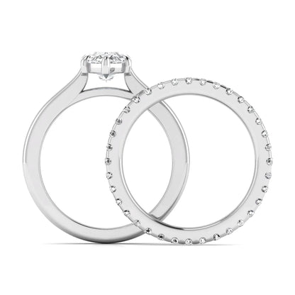 Marquise cut lab grown diamond bridal ring set featuring a six prong solitaire engagement ring with a matching round diamond eternity wedding band in white gold tone.