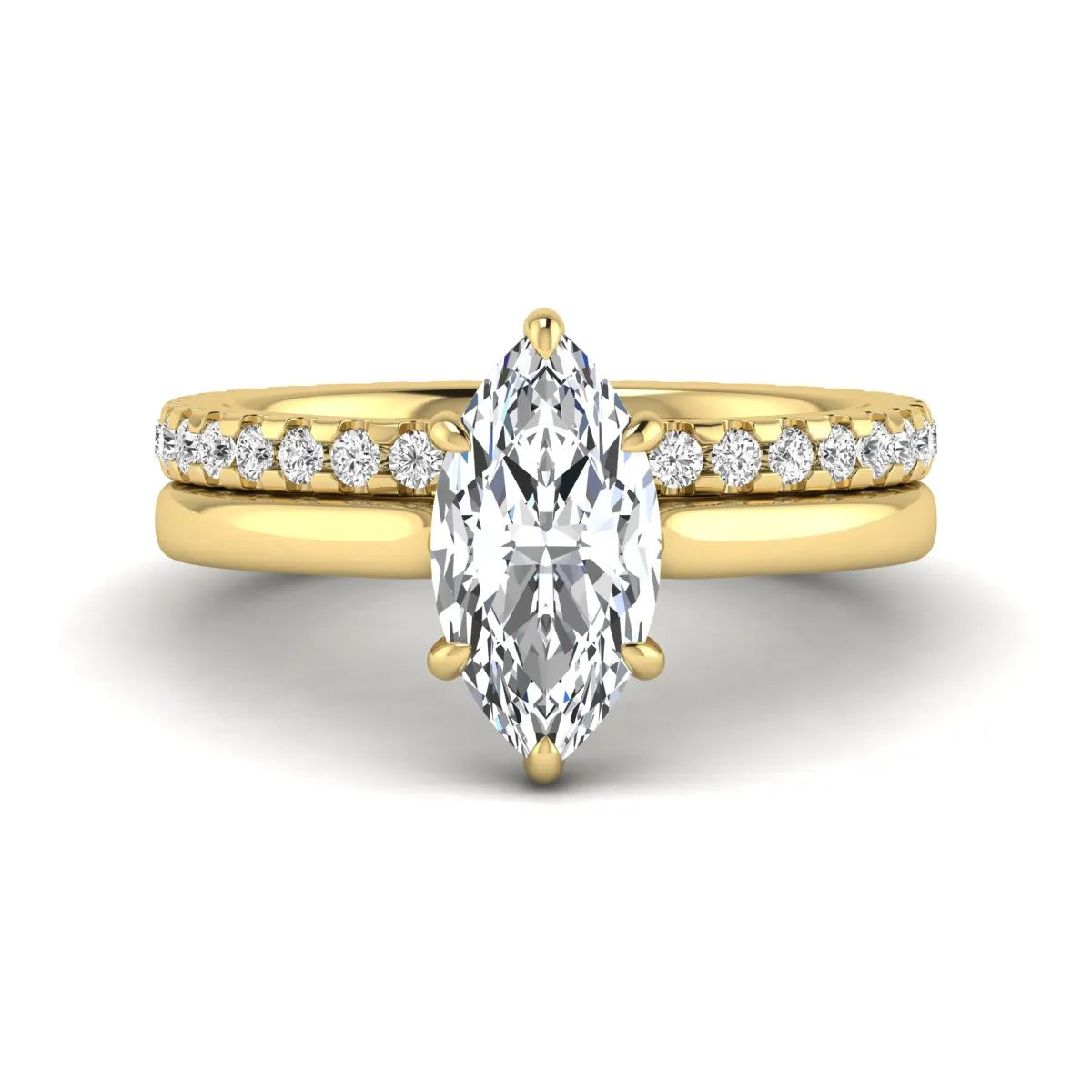 Marquise cut lab grown diamond bridal ring set featuring a six prong solitaire engagement ring with a matching round diamond eternity wedding band in yellow gold tone.