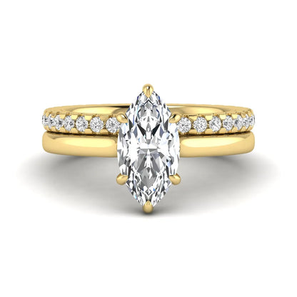 Marquise cut lab grown diamond bridal ring set featuring a six prong solitaire engagement ring with a matching round diamond eternity wedding band in yellow gold tone.