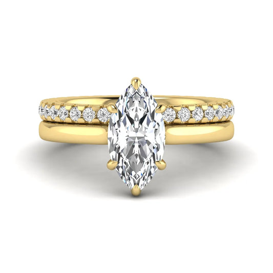 Marquise cut lab grown diamond bridal ring set featuring a six prong solitaire engagement ring with a matching round diamond eternity wedding band in yellow gold tone.