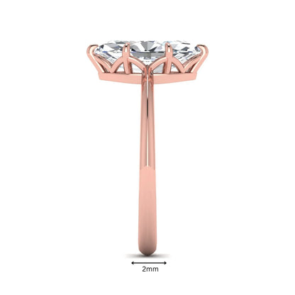 Marquise cut lab grown diamond solitaire engagement ring featuring a six prong basket setting with a polished 2 mm band in rose gold tone.