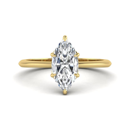 Marquise cut lab grown diamond solitaire engagement ring featuring a six prong basket setting with a polished 2 mm band in yellow gold tone.