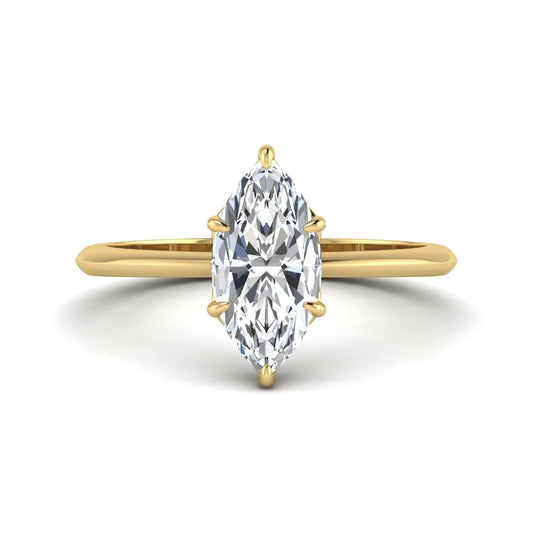 Marquise cut lab grown diamond solitaire engagement ring featuring a six prong basket setting with a polished 2 mm band in yellow gold tone.