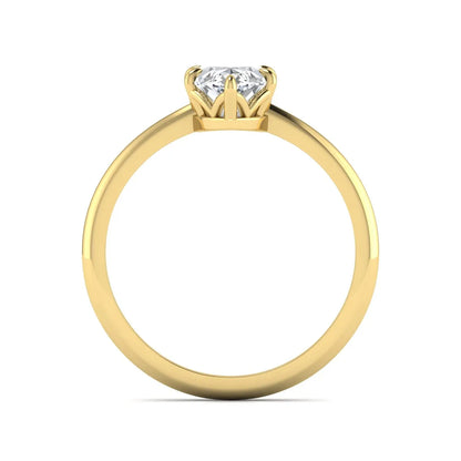 Marquise cut lab grown diamond solitaire engagement ring featuring a six prong basket setting with a polished 2 mm band in yellow gold tone.