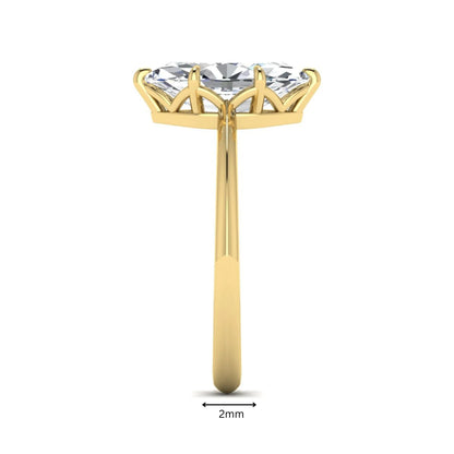 Marquise cut lab grown diamond solitaire engagement ring featuring a six prong basket setting with a polished 2 mm band in yellow gold tone.