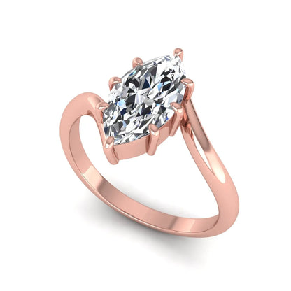 Marquise cut lab grown diamond solitaire engagement ring featuring a graceful bypass band with a six-prong setting in a polished rose gold tone.