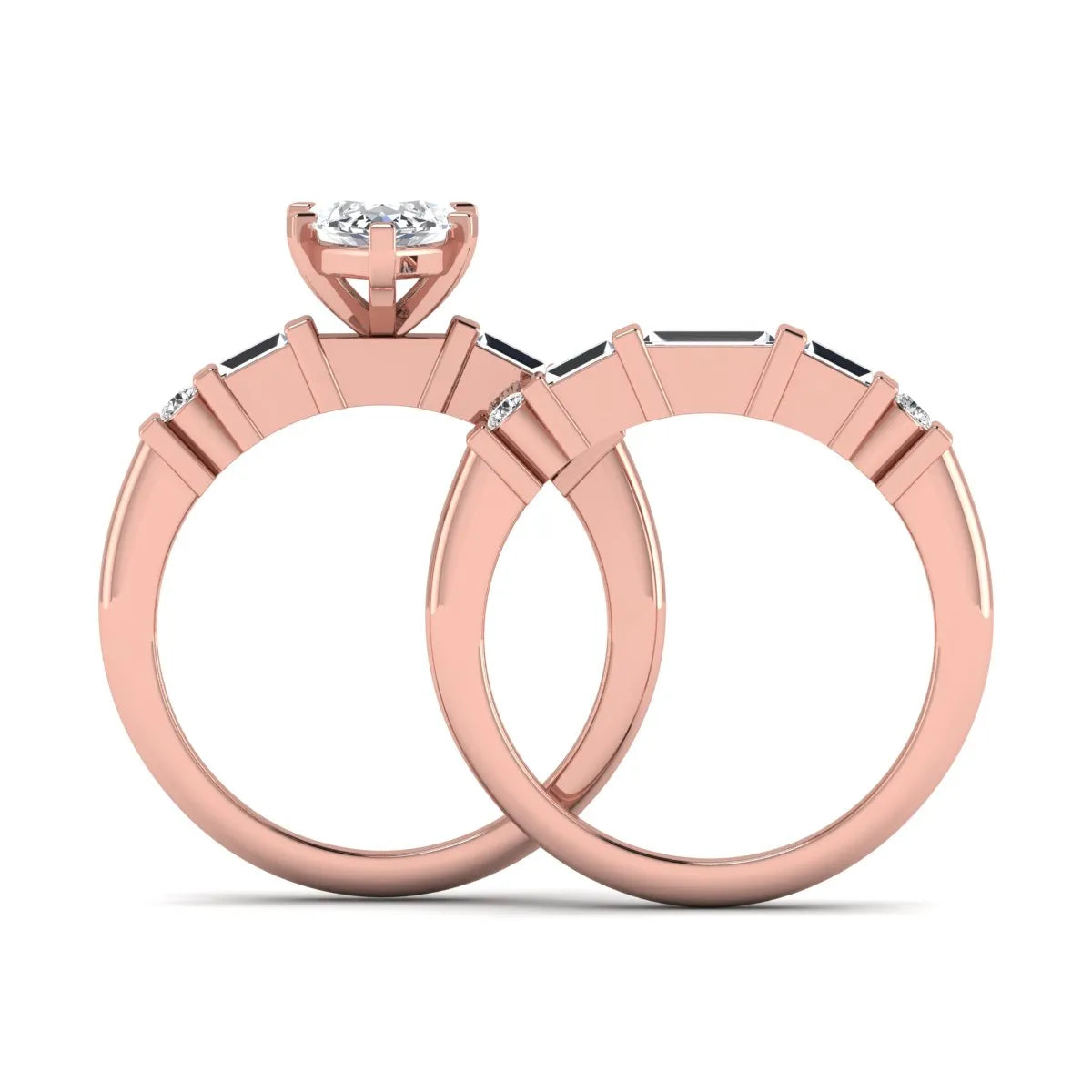 Marquise cut lab grown diamond bridal ring set featuring a six-prong solitaire engagement ring with a contour wedding band accented by baguette and round diamonds in a rose gold finish.