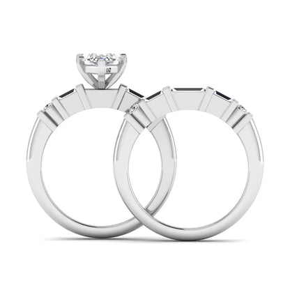 Marquise cut lab grown diamond bridal ring set featuring a six-prong solitaire engagement ring with a contour wedding band accented by baguette and round diamonds in a white gold finish.