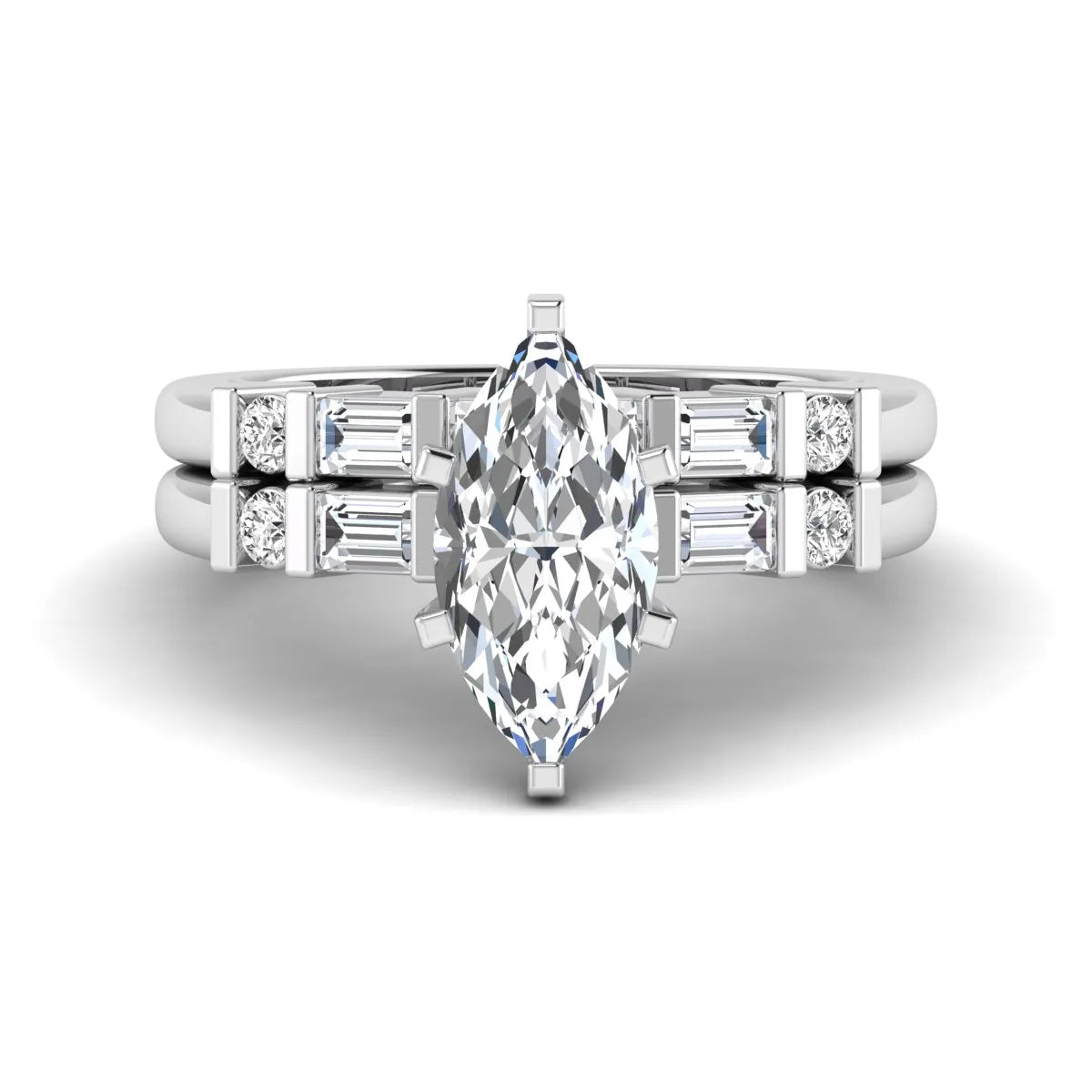 Marquise cut lab grown diamond bridal ring set featuring a six-prong solitaire engagement ring with a contour wedding band accented by baguette and round diamonds in a white gold finish.