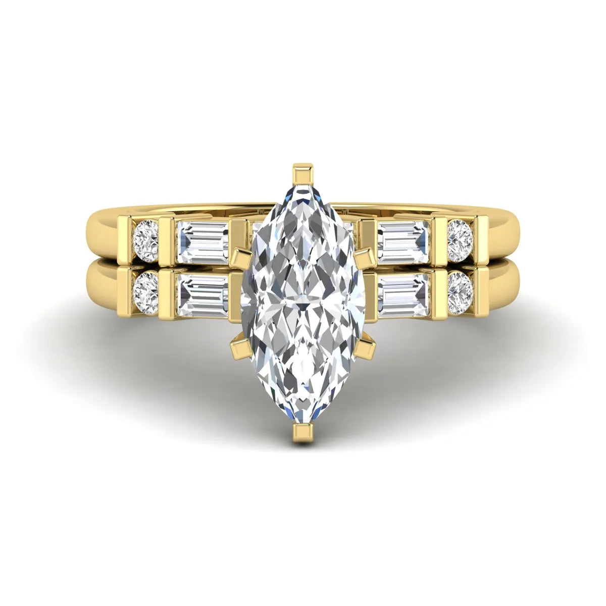 Marquise cut lab grown diamond bridal ring set featuring a six-prong solitaire engagement ring with a contour wedding band accented by baguette and round diamonds in a yellow gold finish.