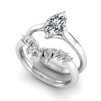 Marquise solitaire lab grown diamond bridal ring set featuring a four-prong marquise center diamond with a crown-inspired contour wedding band accented by pear and round diamonds in white gold