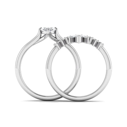 Marquise solitaire lab grown diamond bridal ring set featuring a four-prong marquise center diamond with a crown-inspired contour wedding band accented by pear and round diamonds in white gold