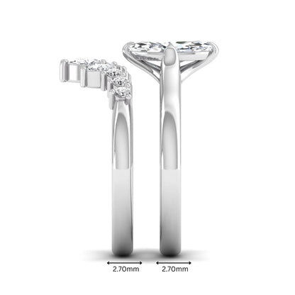 Marquise solitaire lab grown diamond bridal ring set featuring a four-prong marquise center diamond with a crown-inspired contour wedding band accented by pear and round diamonds in white gold