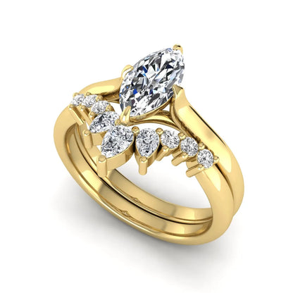 Marquise solitaire lab grown diamond bridal ring set featuring a four-prong marquise center diamond with a crown-inspired contour wedding band accented by pear and round diamonds in yellow gold