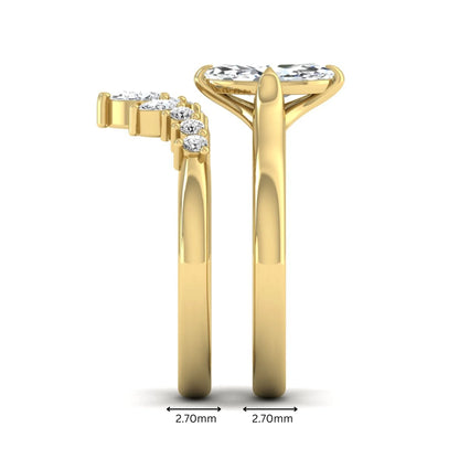Marquise solitaire lab grown diamond bridal ring set featuring a four-prong marquise center diamond with a crown-inspired contour wedding band accented by pear and round diamonds in yellow gold