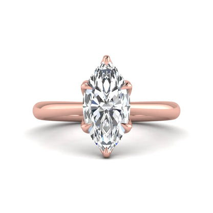 Marquise cut lab grown diamond solitaire engagement ring with six-prong setting and rose gold tone band.