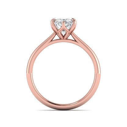 Marquise cut lab grown diamond solitaire engagement ring with six-prong setting and rose gold tone band.