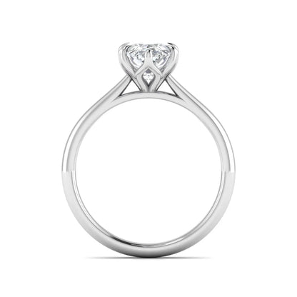 Marquise cut lab grown diamond solitaire engagement ring with six-prong setting and white gold tone band.