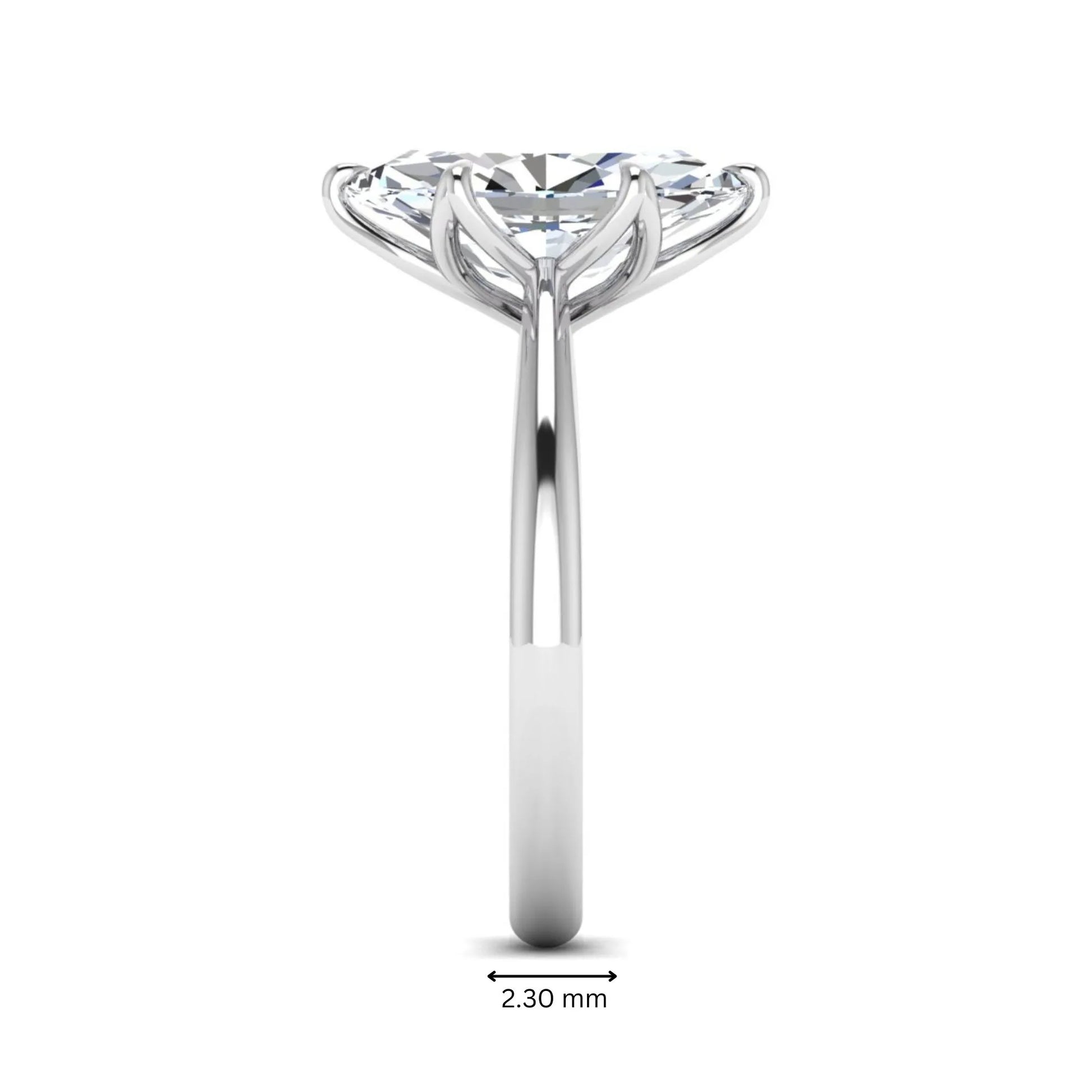 Marquise cut lab grown diamond solitaire engagement ring with six-prong setting and white gold tone band.
