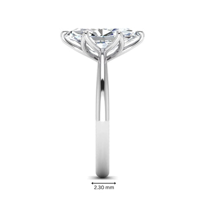 Marquise cut lab grown diamond solitaire engagement ring with six-prong setting and white gold tone band.