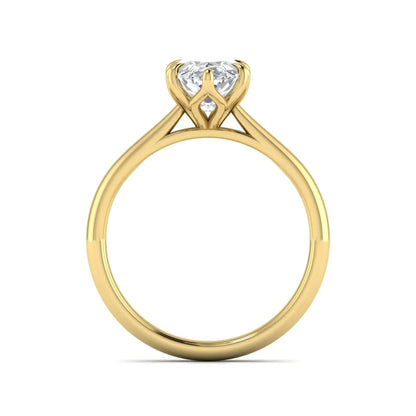 Marquise cut lab grown diamond solitaire engagement ring with six-prong setting and yellow gold tone band.