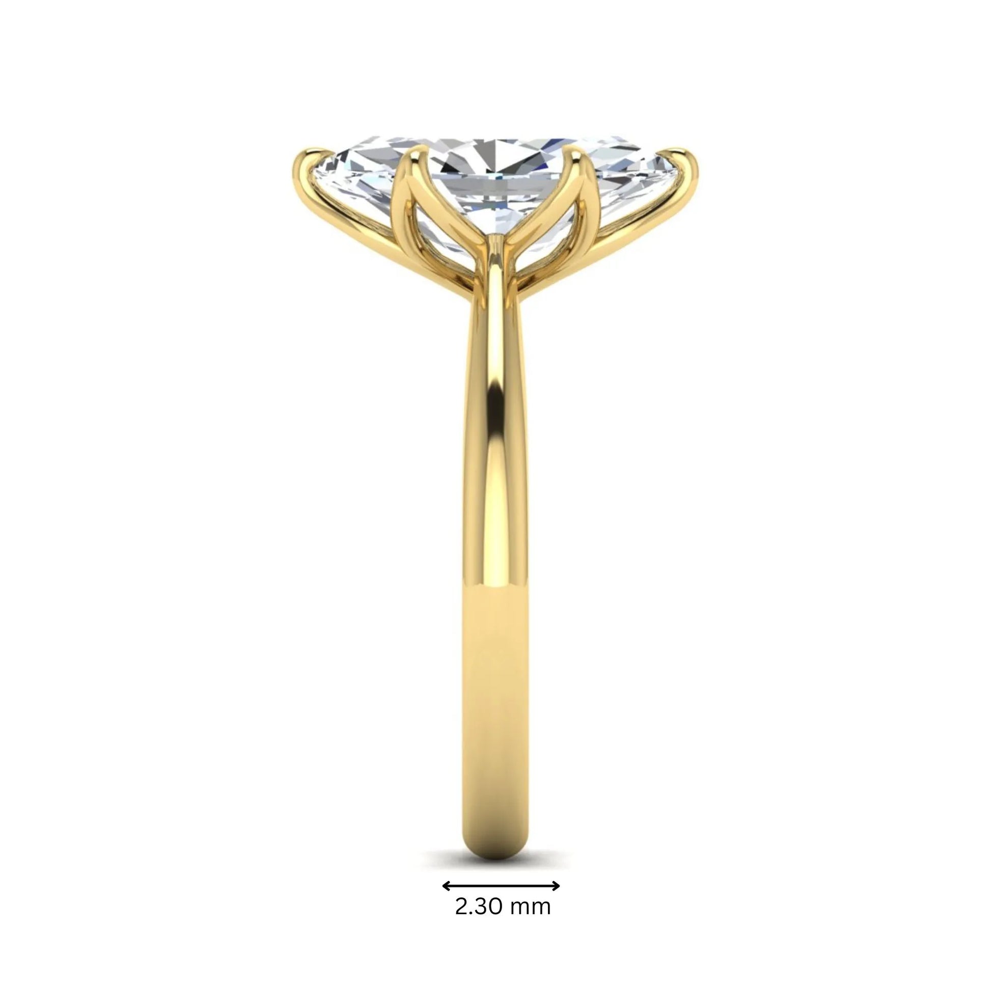 Marquise cut lab grown diamond solitaire engagement ring with six-prong setting and yellow gold tone band.