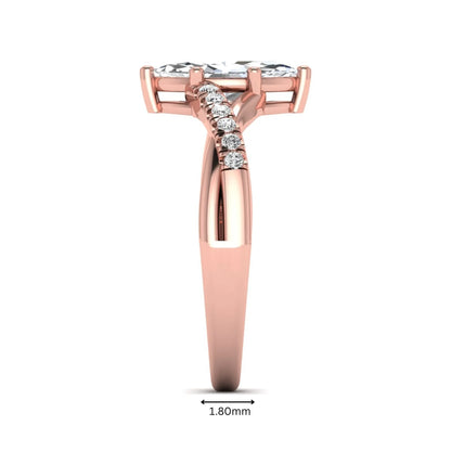 IGI Certified 0.95 carat marquise cut lab grown diamond split shank engagement ring with round accent diamonds in rose gold.