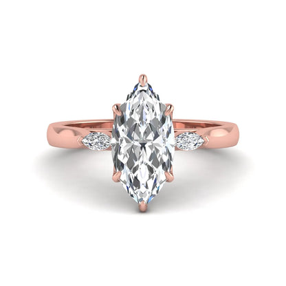 Marquise three stone lab grown diamond engagement ring featuring a 2.48 carat IGI certified center diamond with marquise side diamonds in rose gold