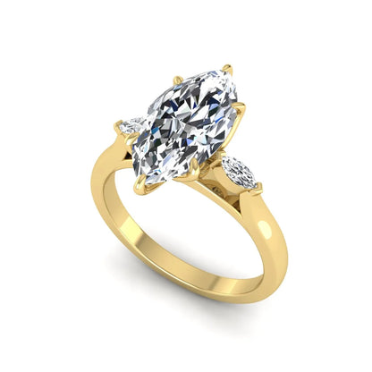 Marquise three stone lab grown diamond engagement ring featuring a 2.48 carat IGI certified center diamond with marquise side diamonds in yellow gold