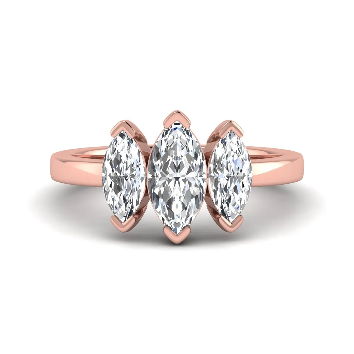 Marquise three stone lab grown diamond engagement ring featuring a center marquise diamond with matching side stones in rose gold design.