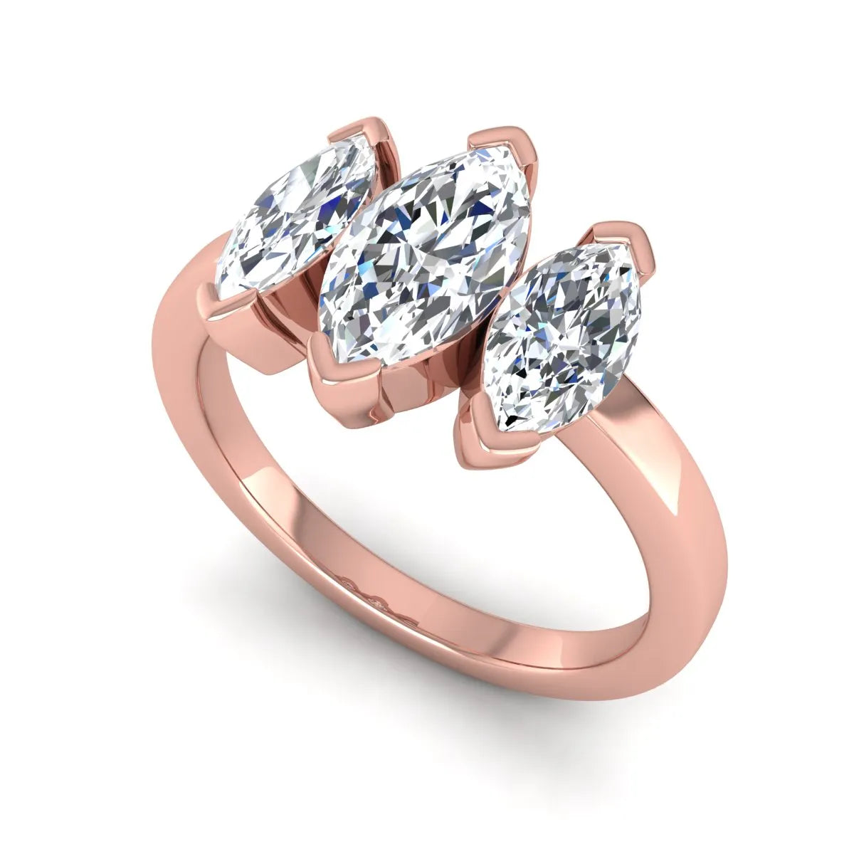 Marquise three stone lab grown diamond engagement ring featuring a center marquise diamond with matching side stones in rose gold design.