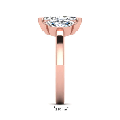 Marquise three stone lab grown diamond engagement ring featuring a center marquise diamond with matching side stones in rose gold design.
