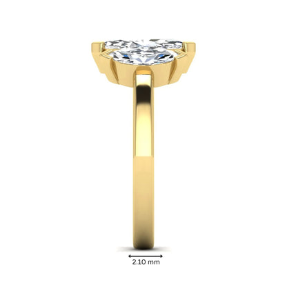 Marquise three stone lab grown diamond engagement ring featuring a center marquise diamond with matching side stones in yellow gold design.