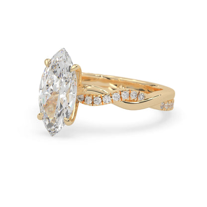 marquise brilliant lab grown diamond engagement ring with prong setting and twisted pavé diamond band in yellow gold tone