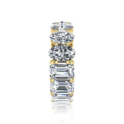 Mixed emerald and oval cut lab grown diamond full eternity band featuring alternating diamonds in a shared prong setting in yellow gold