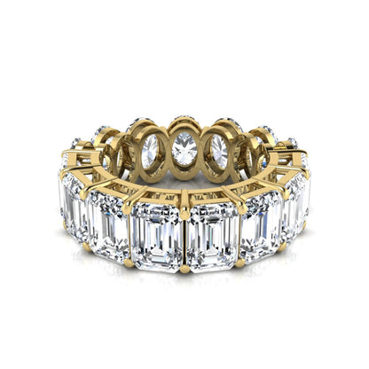 Mixed emerald and oval cut lab grown diamond full eternity band featuring alternating diamonds in a shared prong setting in yellow gold