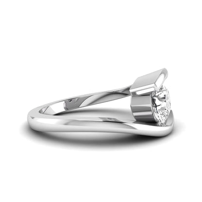 Round cut lab grown diamond solitaire engagement ring with a modern bypass setting in a white gold tone contemporary design.