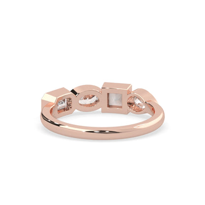 Multi shape lab grown diamond half eternity wedding band with emerald, pear, oval and princess cut diamonds in bezel settings in rose gold