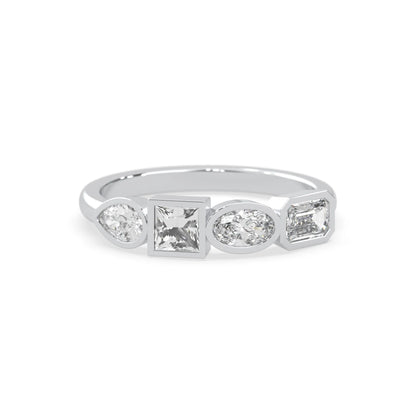 Multi shape lab grown diamond half eternity wedding band with emerald, pear, oval and princess cut diamonds in bezel settings in white gold