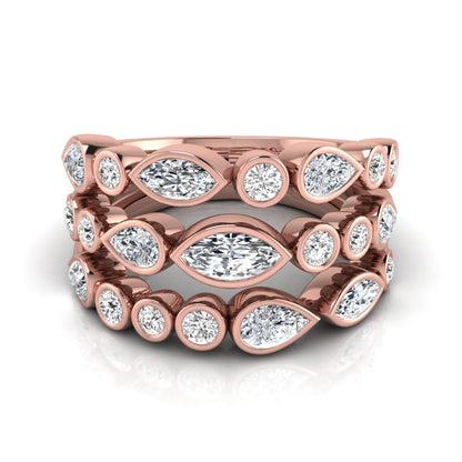 Multi shape lab grown diamond stacking ring featuring marquise, pear, and round bezel set diamonds totaling 1.50 carats in rose gold.