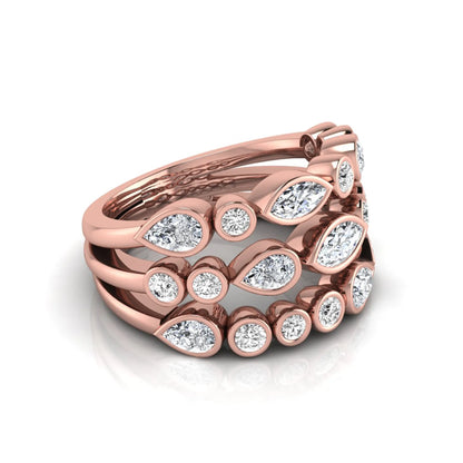 Multi shape lab grown diamond stacking ring featuring marquise, pear, and round bezel set diamonds totaling 1.50 carats in rose gold.