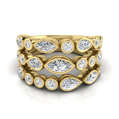 Multi shape lab grown diamond stacking ring featuring marquise, pear, and round bezel set diamonds totaling 1.50 carats in yellow gold.