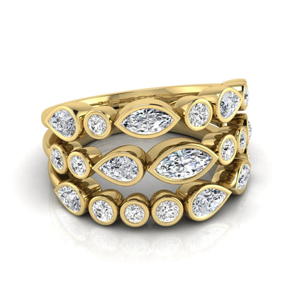 Multi shape lab grown diamond stacking ring featuring marquise, pear, and round bezel set diamonds totaling 1.50 carats in yellow gold.