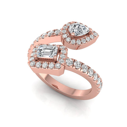 rose gold Open bypass lab grown diamond wrap ring featuring pear cut and emerald cut diamonds surrounded by halo accents with a pavé diamond band.